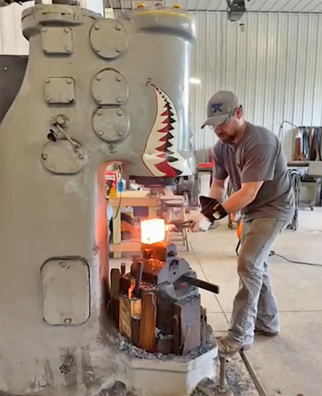 Luke Dellmyer forging on his air hammer