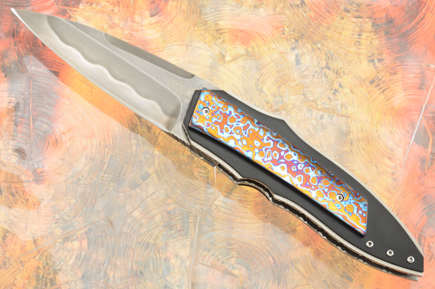 X-Plain Front Flipper with Titanium Damascus and Marbled Carbon Fiber