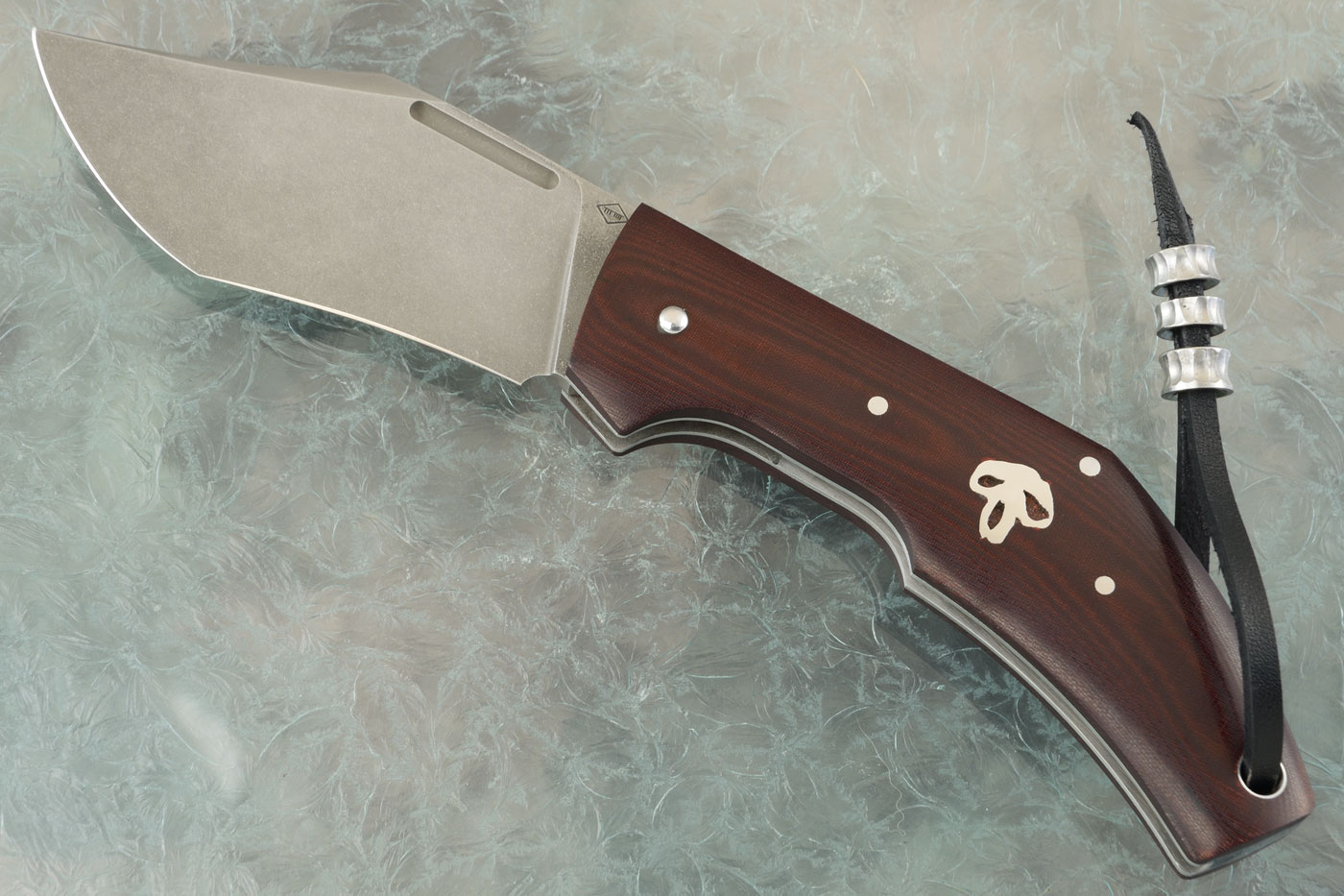 Superbad Slipjoint Folder with Burgundy Micarta with Skull Inlay