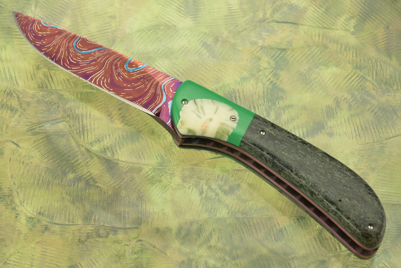 Flipper with Heat Colored Damascus, Ancient Sea Cow Bone, and Warthog Tusk