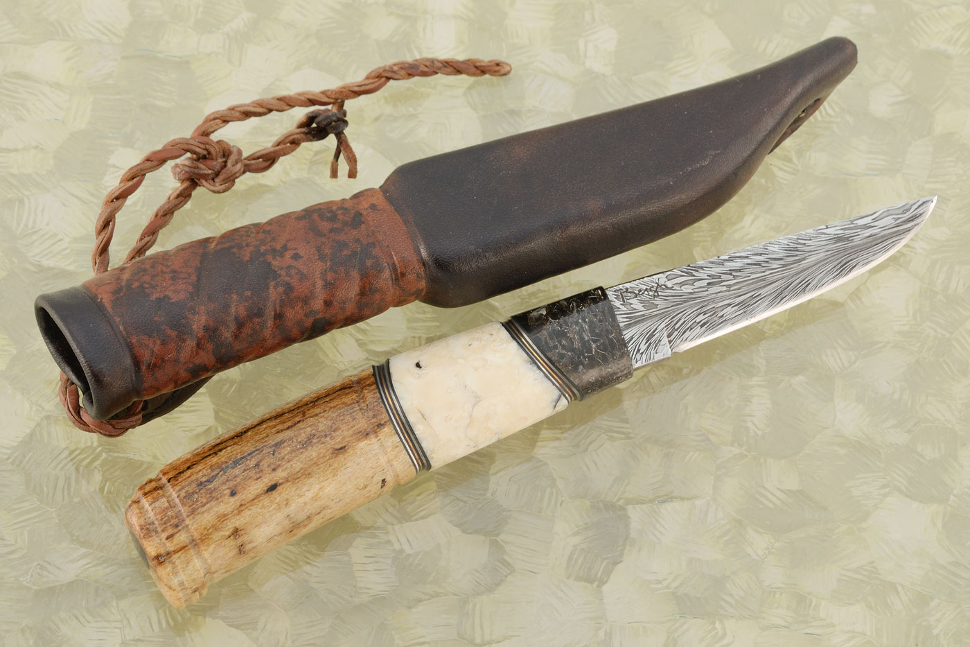 Feather Damascus Puukko with Seacow Bone, Walrus Ivory, and Mammoth Bone
