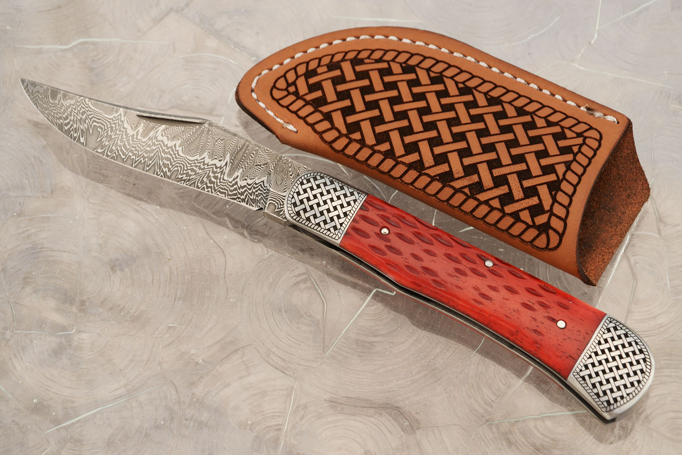 Damascus Slipjoint Trapper with Red Jigged Bone