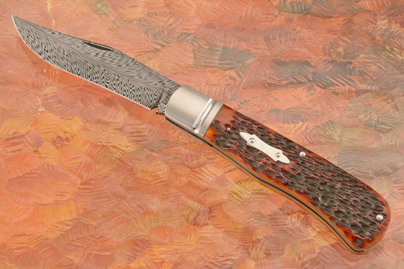 Feather Damascus Slipjoint Trapper with Amber Jigged Bone