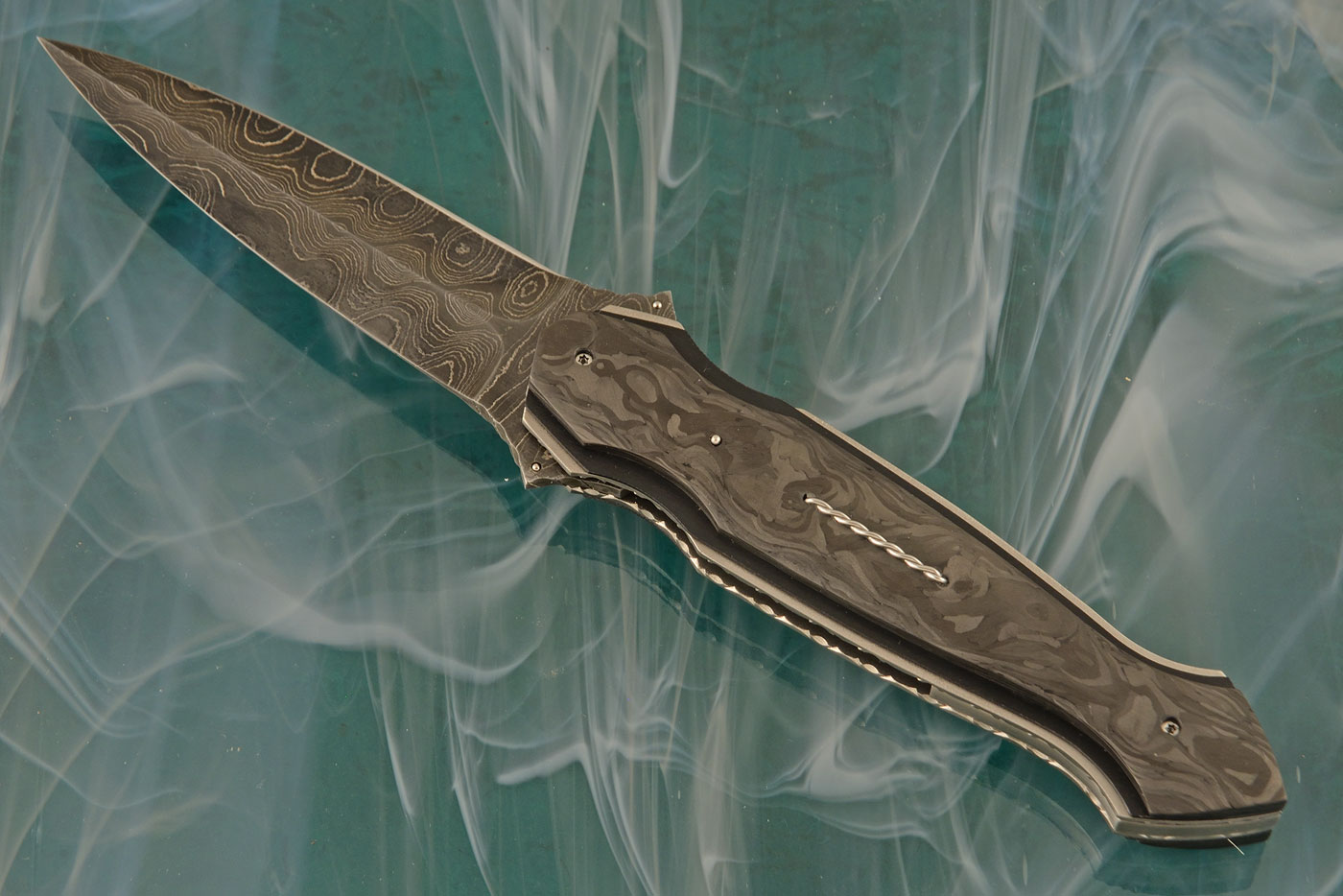 Folding Dagger Flipper with Marbled Carbon Fiber and Damascus