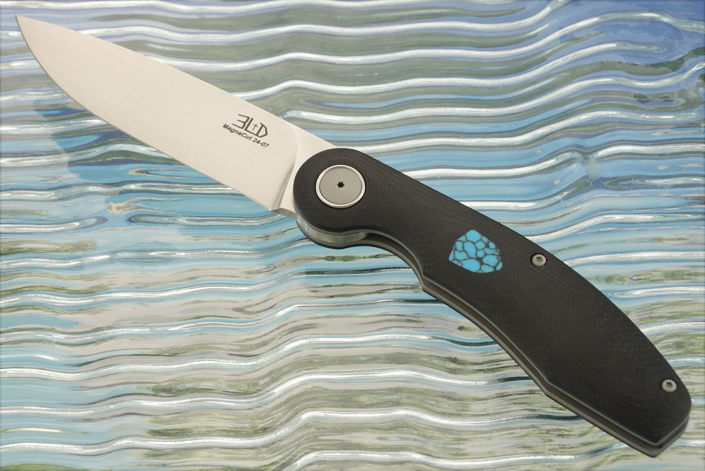 A7 Double Detent Folder with Black G-10 and Turquoise - CPM-MagnaCut