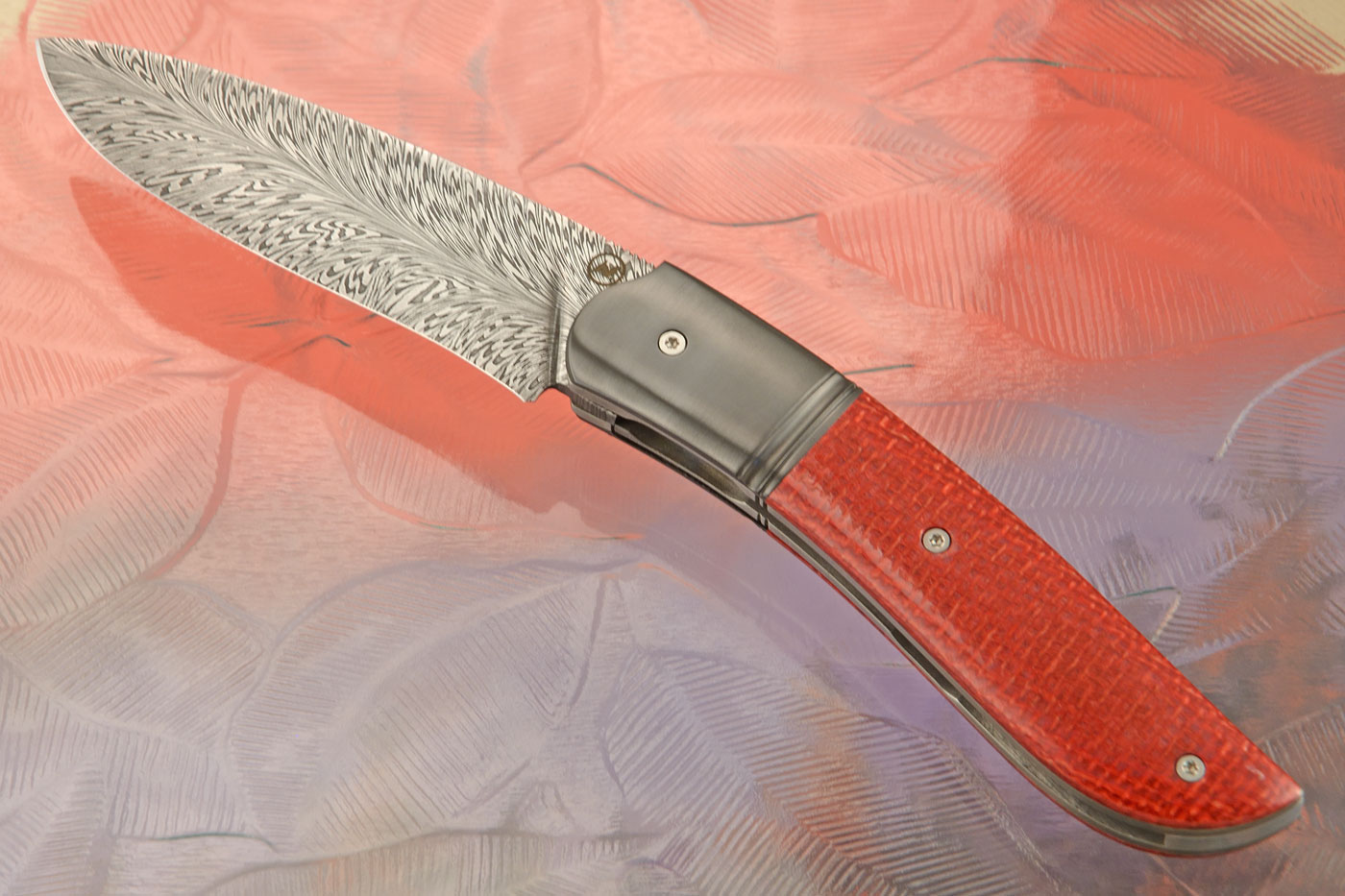 Gyr Front Flipper with Feather Damascus, Red Mciarta, and Zirconium