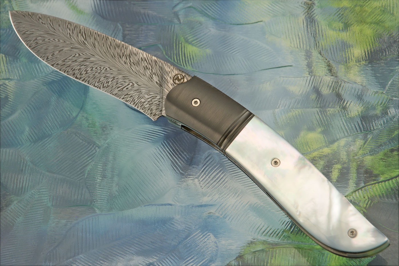 Gyr Front Flipper with Feather Damascus, Mother of Pearl, and Zirconium