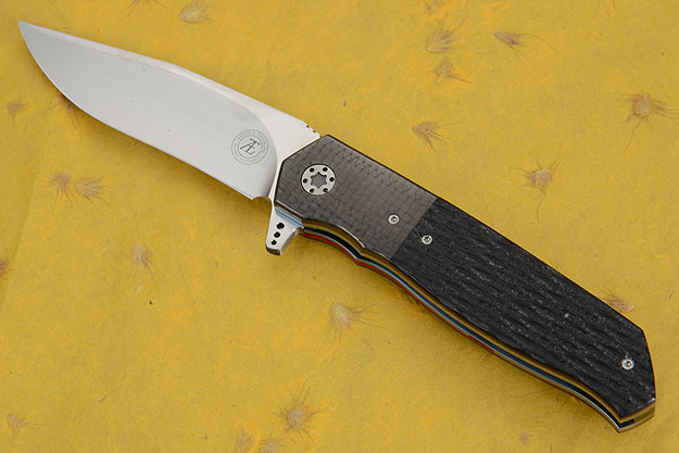 L36M Flipper with Jigged Black G10 and Carbon Fiber (IKBS)